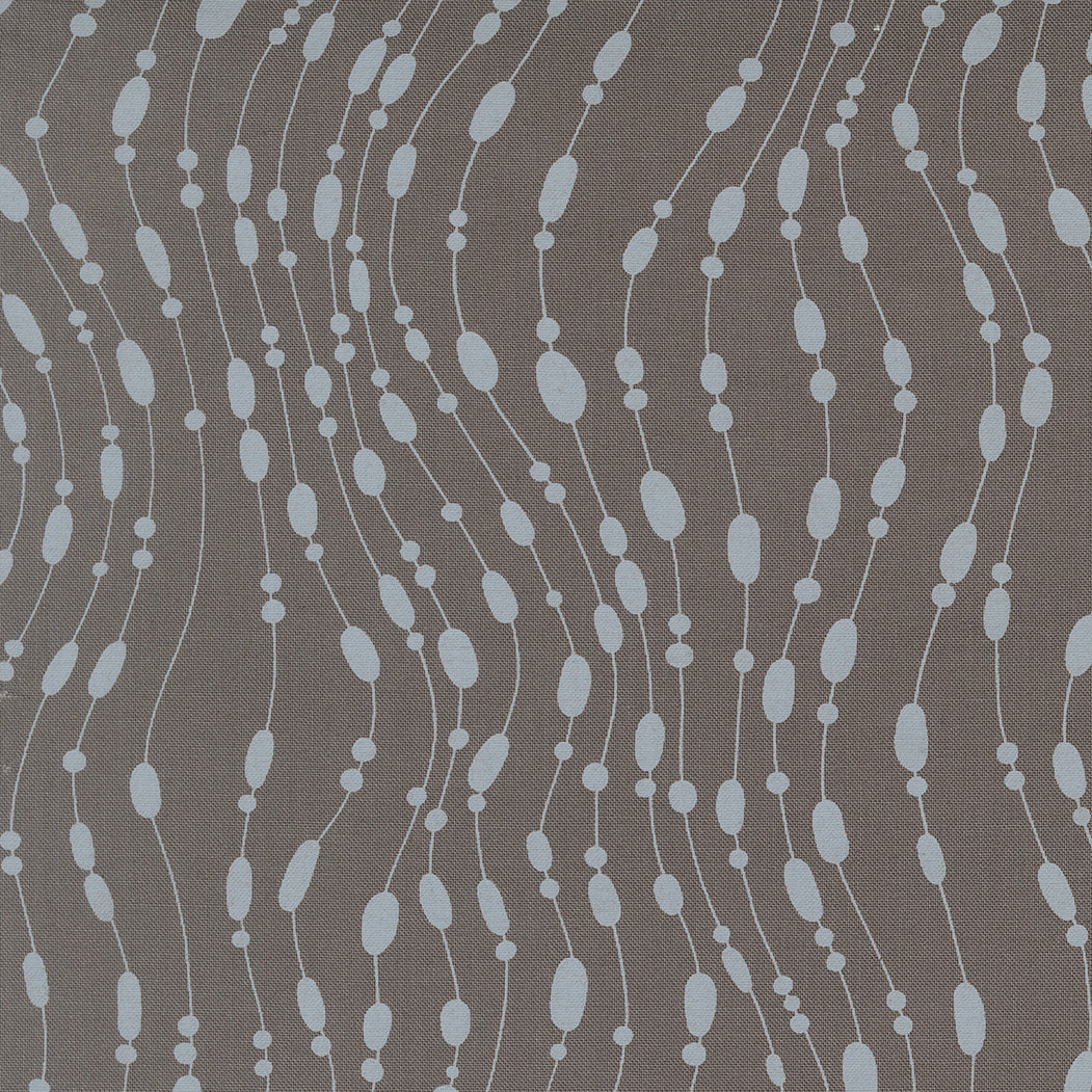 Patterned fabric with blue and white design on a gray background