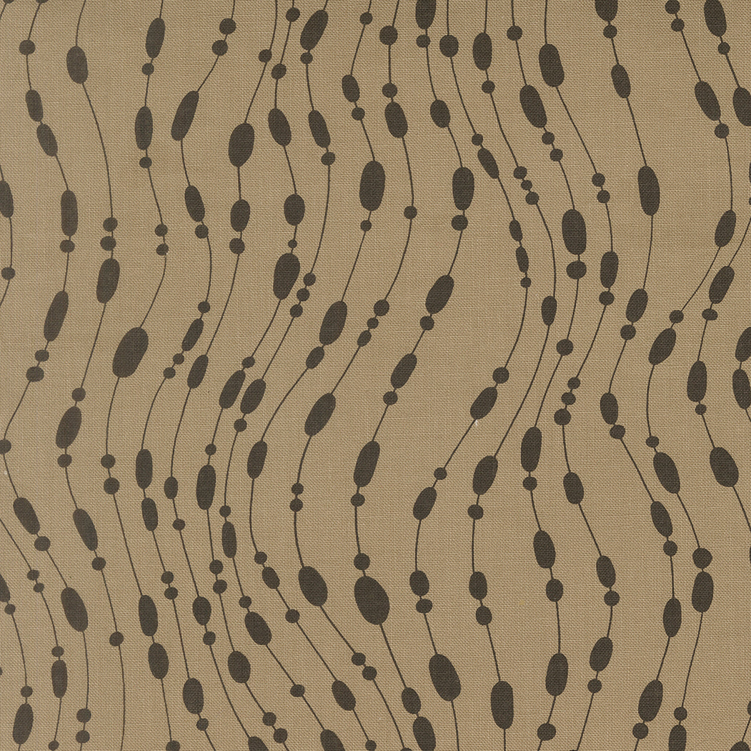 Brown fabric with black bead-like pattern