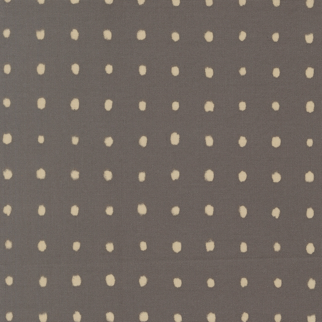 Pattern of small beige dots on a gray background