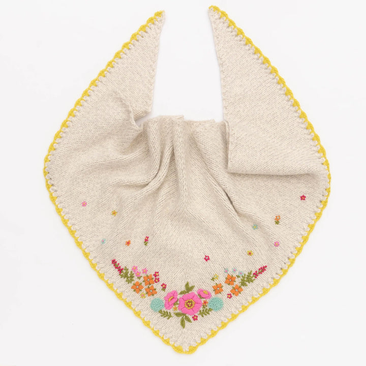 Knitted shawl with floral embroidery on a white background
