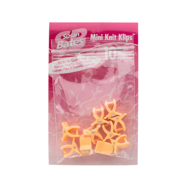 package of tiny orange claw style clips designed for marking or holding stitches in yarn projects