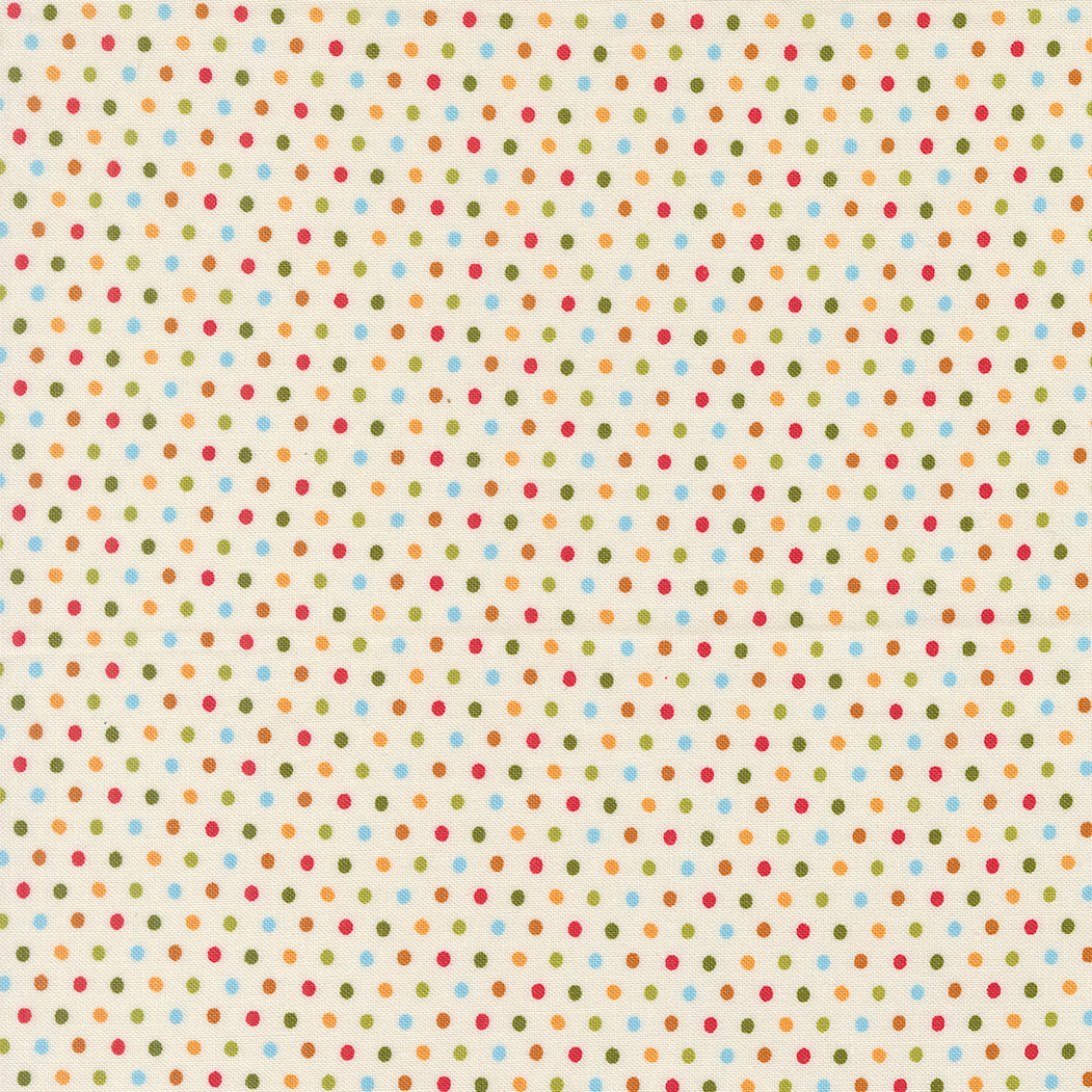 Pattern of small multicolored dots on a beige background