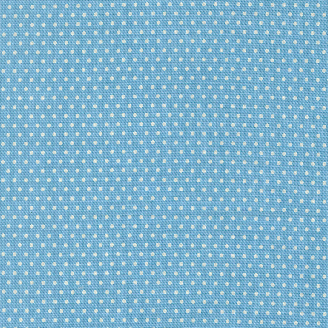 Blue fabric with small white polka dots