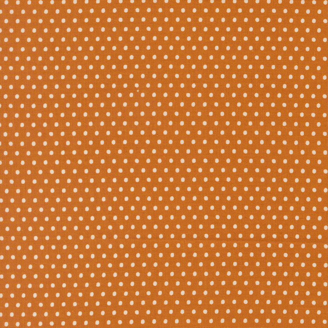 Brown fabric with small white polka dots