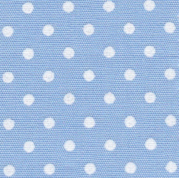Close-up of blue cotton fabric with a pattern of white dots