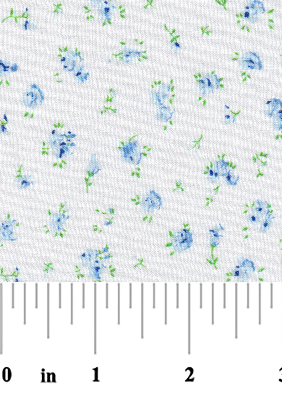 Floral pattern with blue flowers and green leaves on a white background, measured with a ruler.