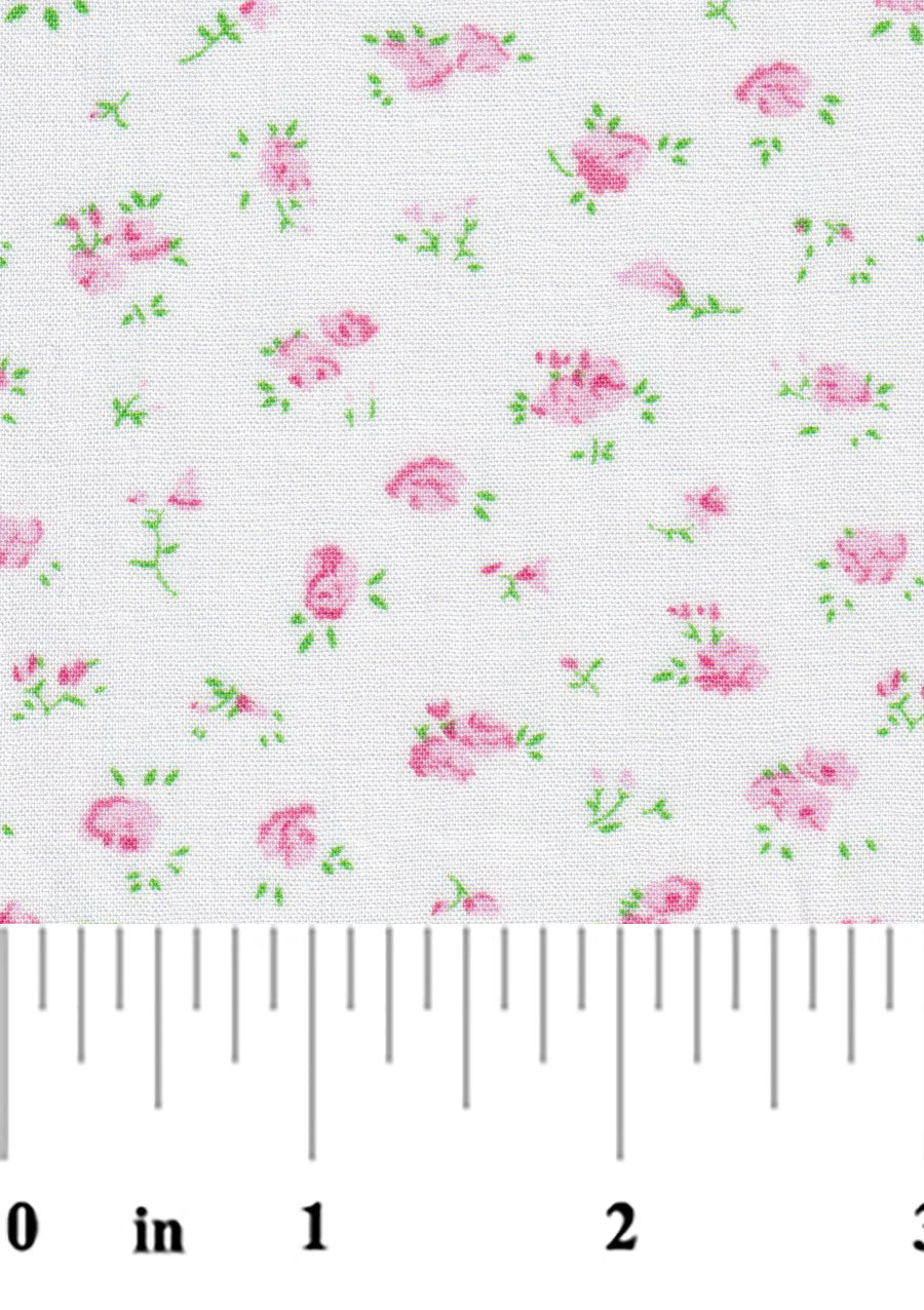 Floral pattern with pink flowers and green leaves on a white background, measured with a ruler.