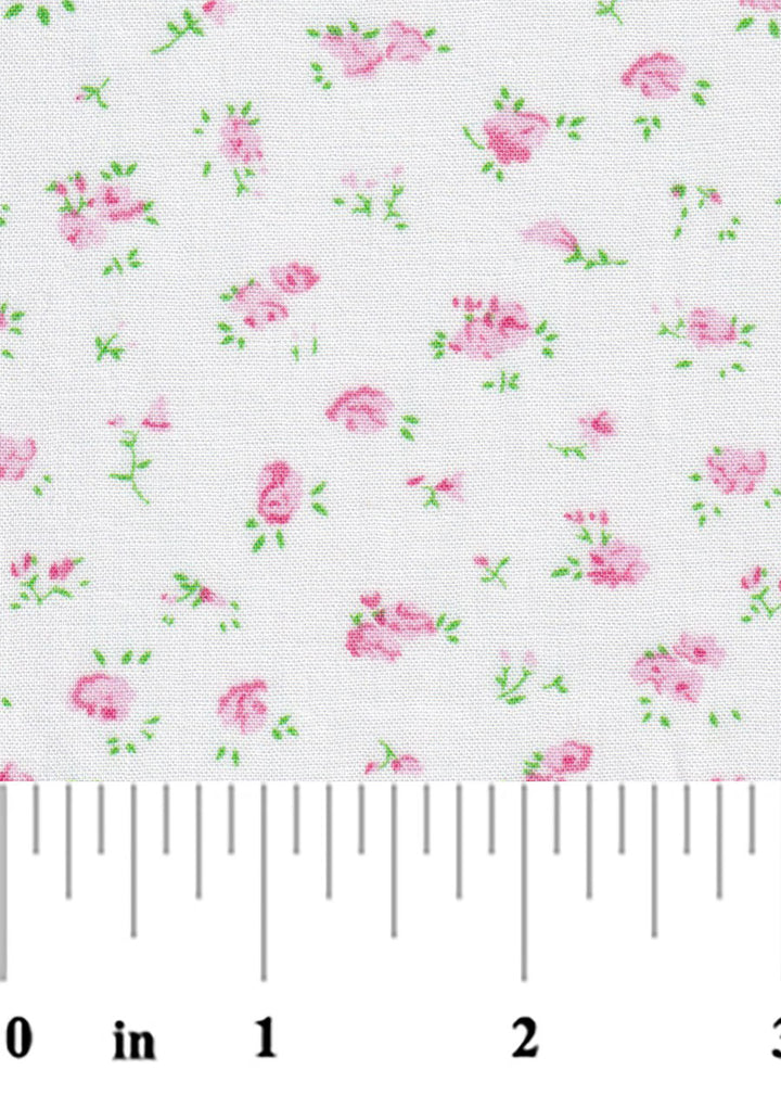 Floral pattern with pink flowers and green leaves on a white background, measured with a ruler.