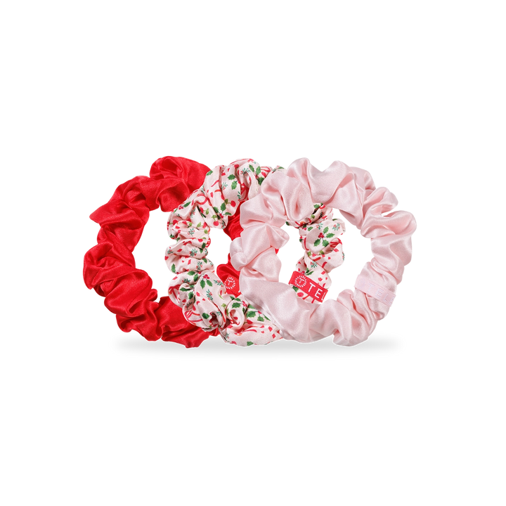 Set of three scrunchies in red, floral, and pink on a white background