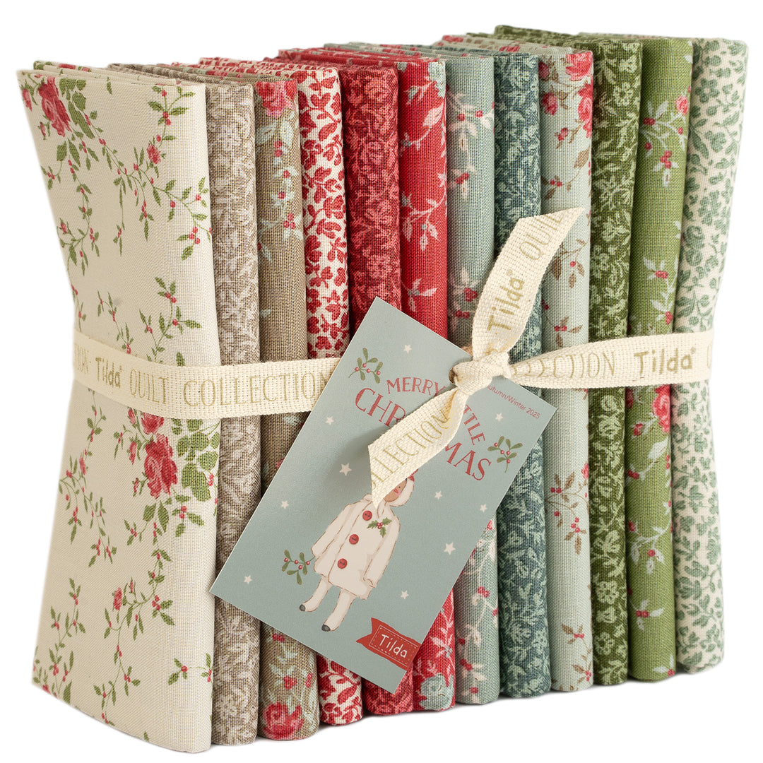 Set of floral fabric rolls with Christmas-themed tags, tied together with a ribbon.
