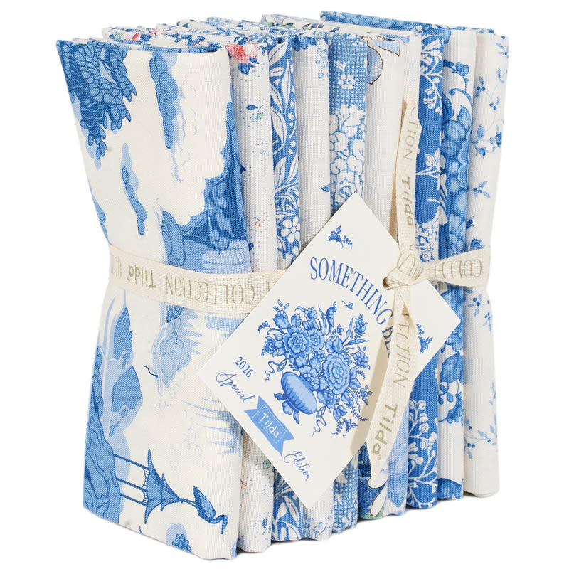 Pack of blue and white patterned fabric strips with a visible brand tag on a white background