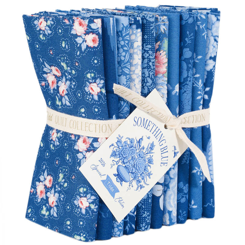 Set of blue floral fabric bundles with a tag on a white background