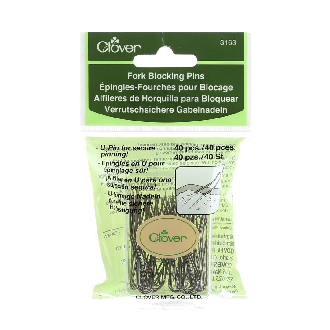 Packaging of Clover fork blocking pins with green and white design.