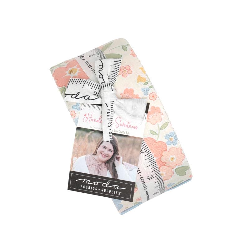 Pack of fabric squares with floral and patterned designs, featuring Moda brand on a white background.