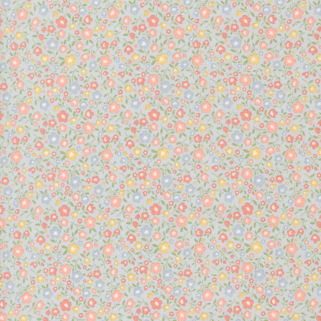 Pattern of small flowers on a light blue background