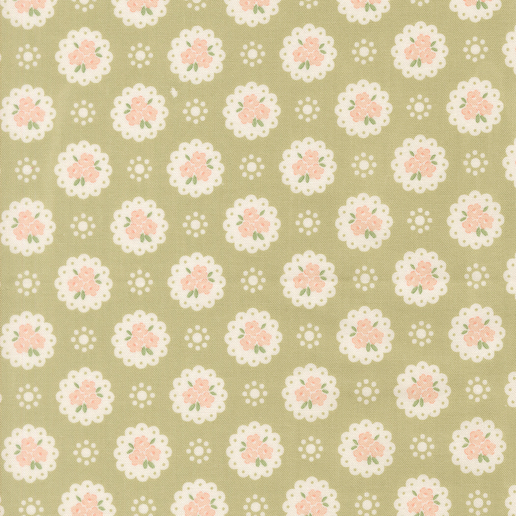 Patterned fabric with floral design on a green background