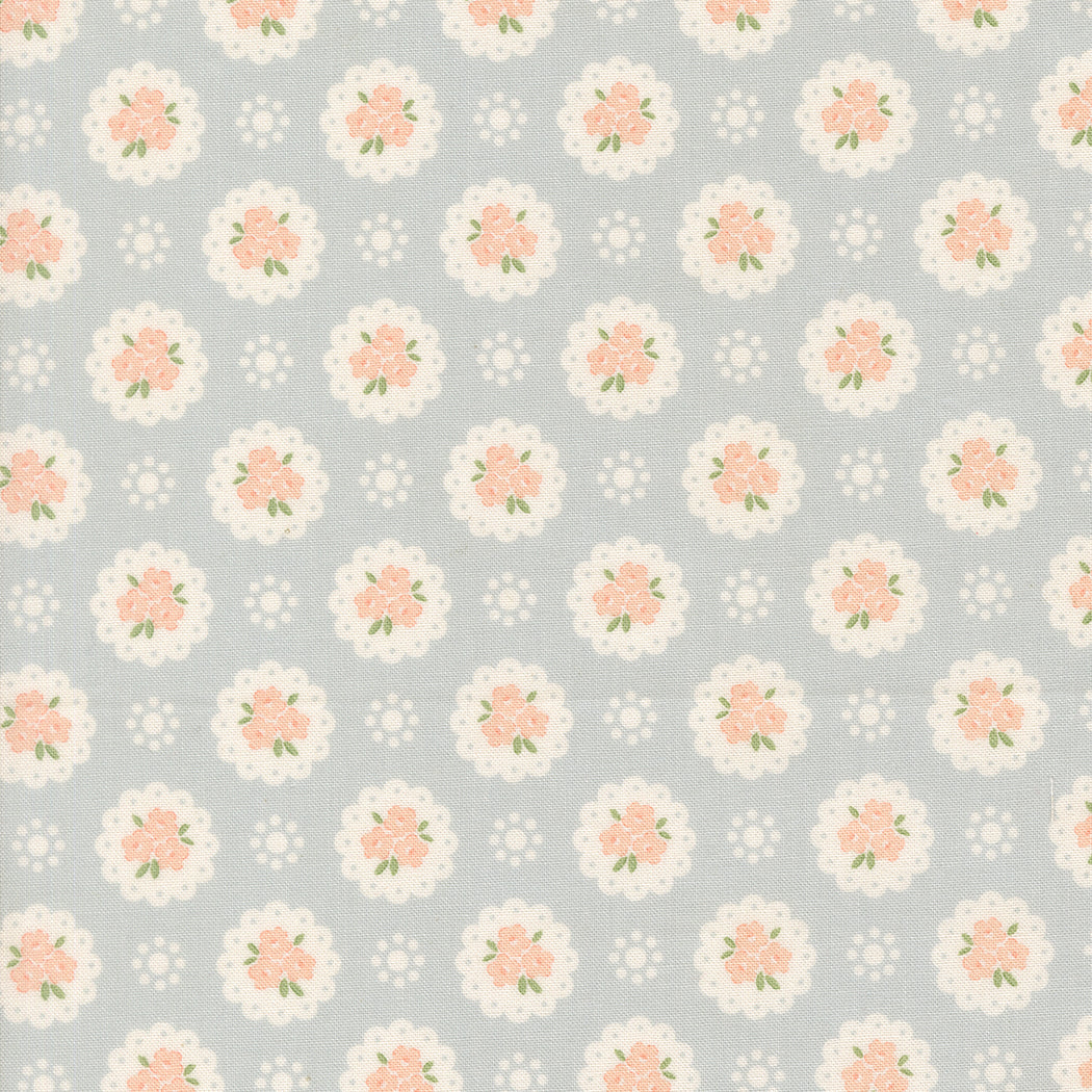 Pattern of small flowers on a light gray background
