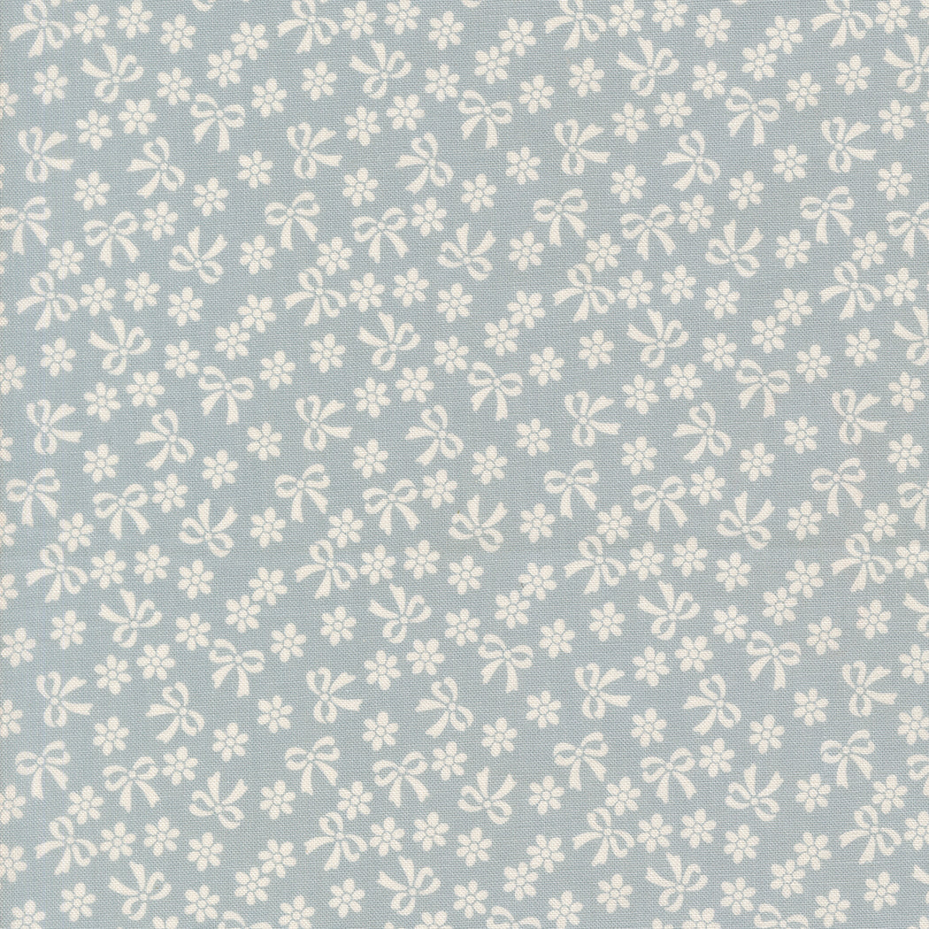 Pattern of white bows and flowers on a light blue background