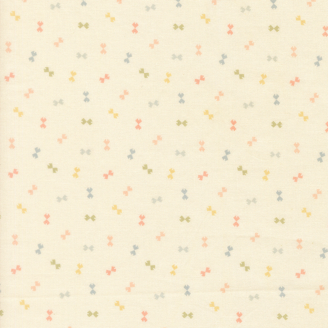 Pattern of small colorful bows on a beige background