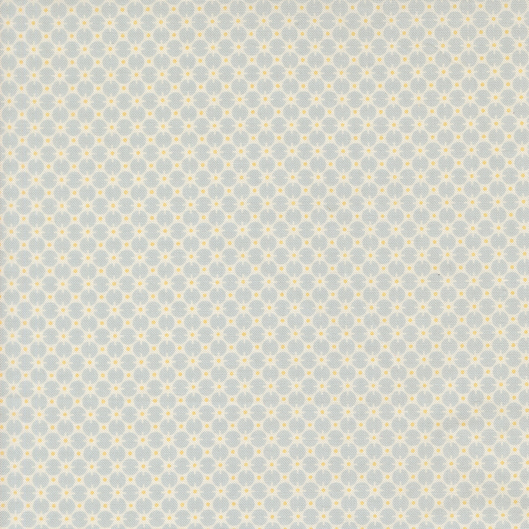 Patterned fabric with small geometric design on a light blue background