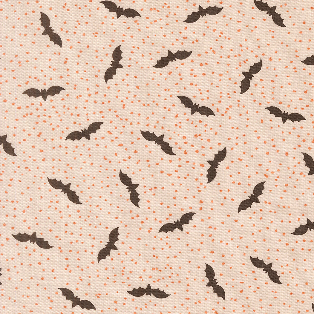 Pattern of black bats on a beige background with small orange dots.