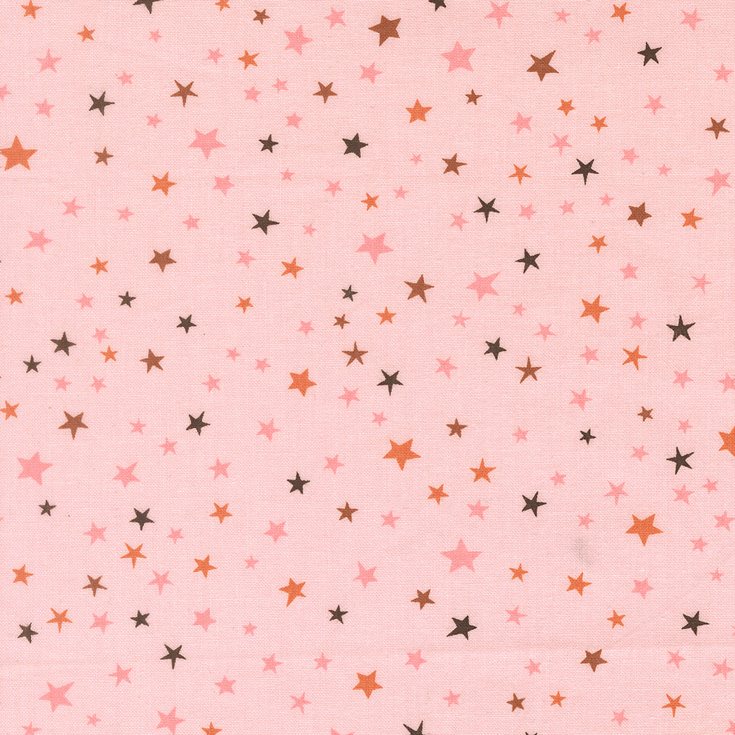 Pattern of small stars in various colors on a pink background