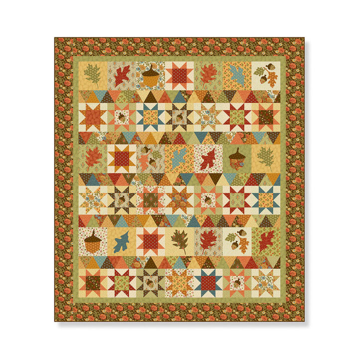Colorful quilt with autumn-themed patterns on a white background