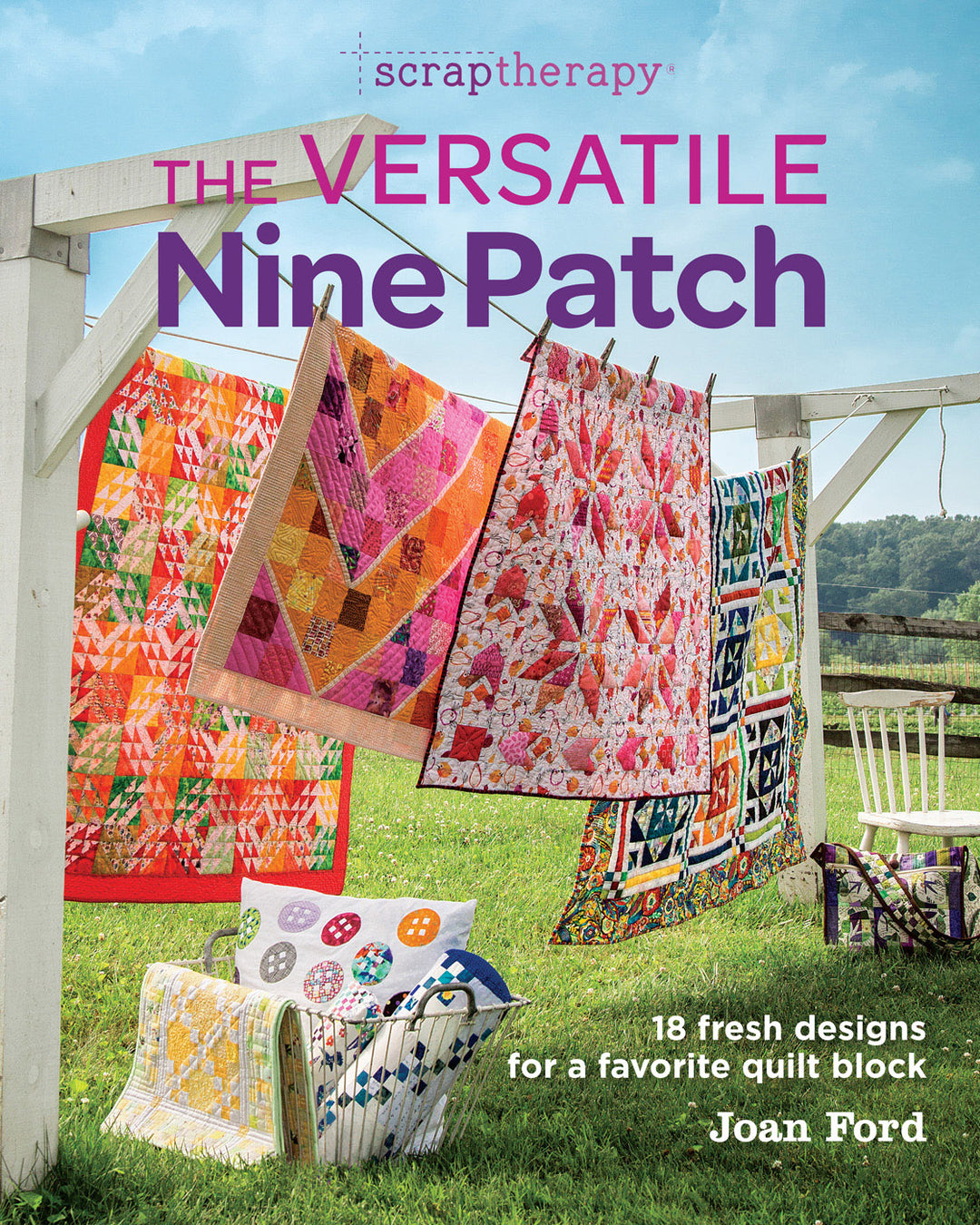 The Versatile Nine Patch book with colorful quilts hanging on a clothes line. 