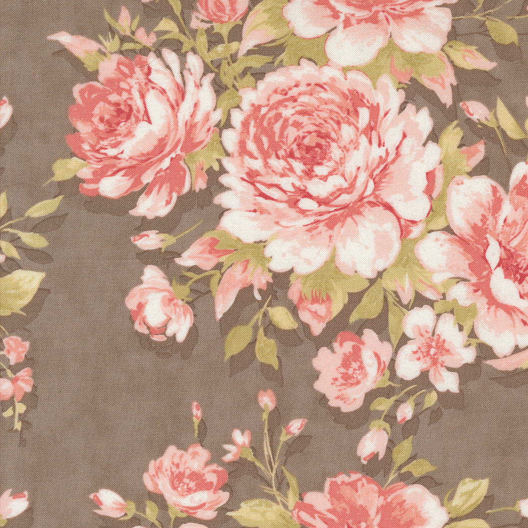 fabric swatch with a print of soft pink roses and greenery on a slate gray background