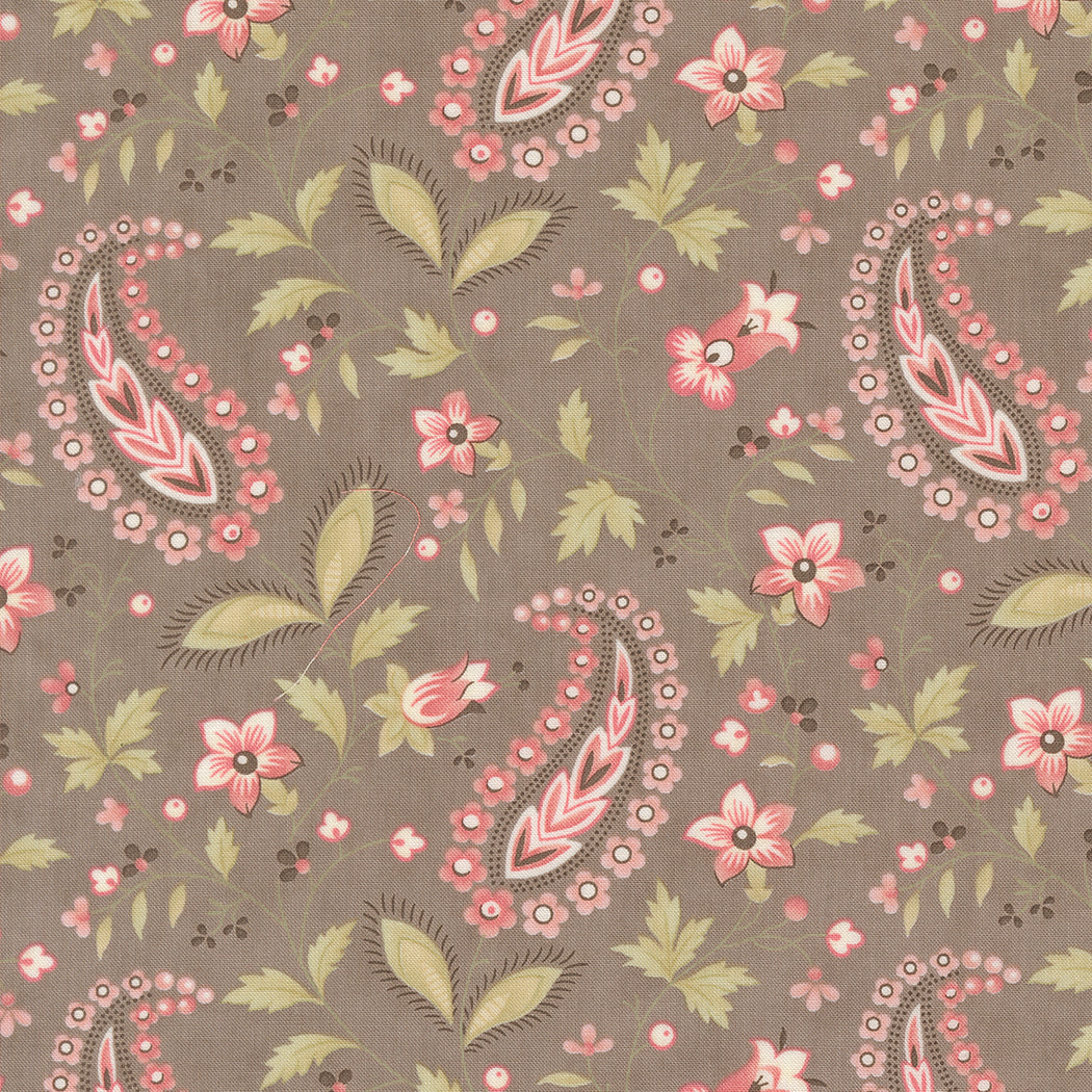 fabric swatch of a paisley print of pink hearts and florals and greenery on a slate gray background