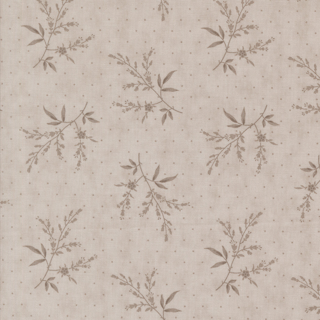 fabric swatch with small gray florals and greenery sprinkled on a lighter stone gray background with gray dots