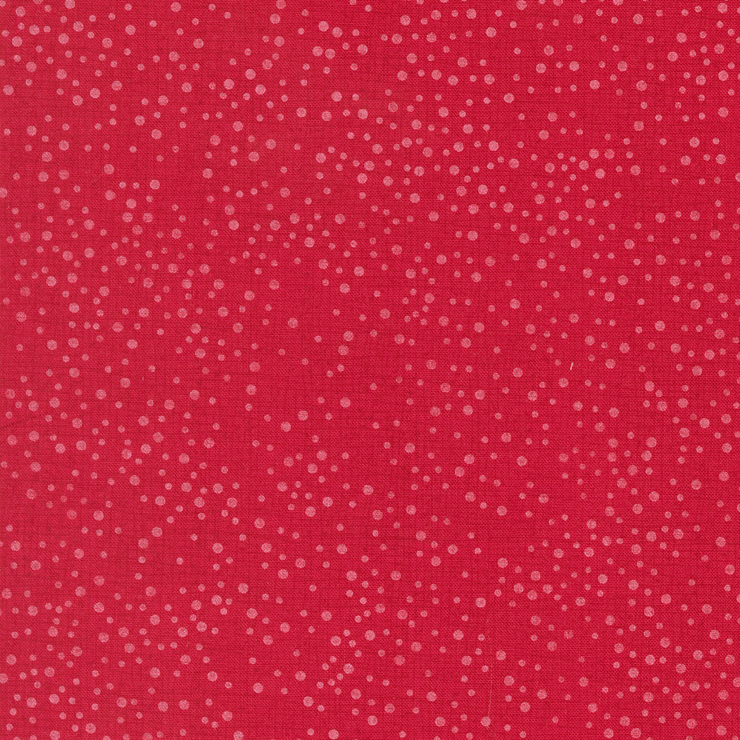 Red fabric with small white dot pattern