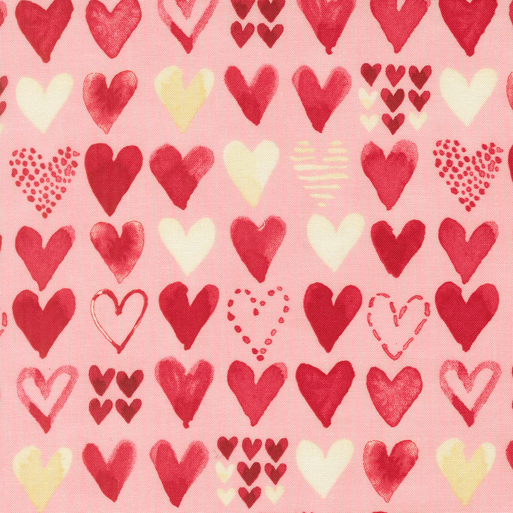 Pattern of red, pink, and yellow hearts on a pink background