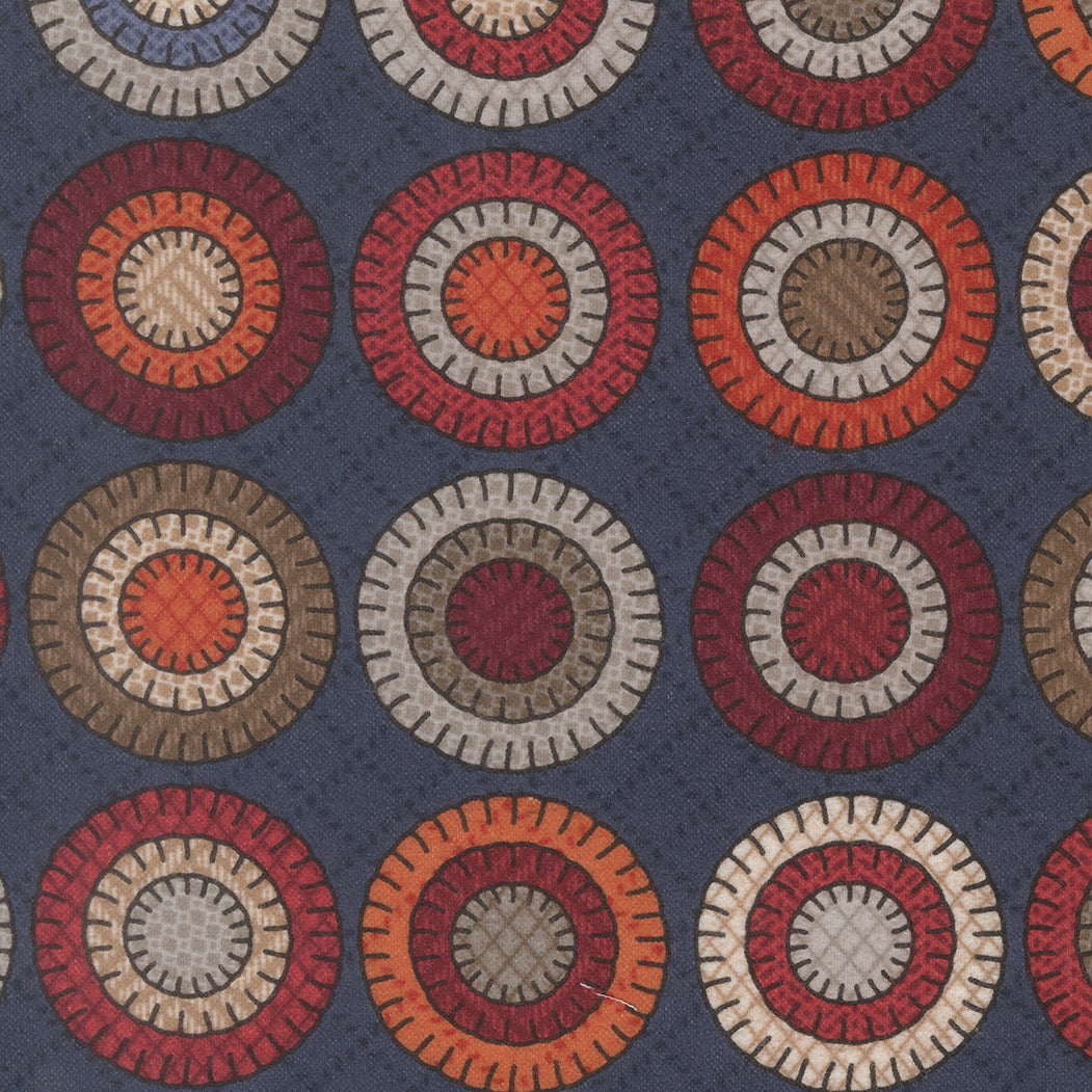 Pattern of circular shapes in red, brown, and beige on a blue background
