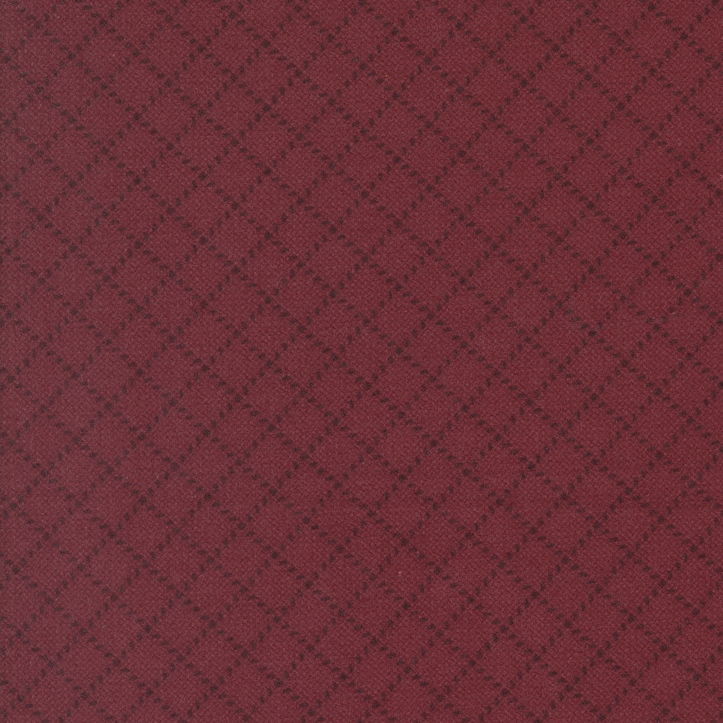 Maroon fabric texture with a subtle diamond pattern