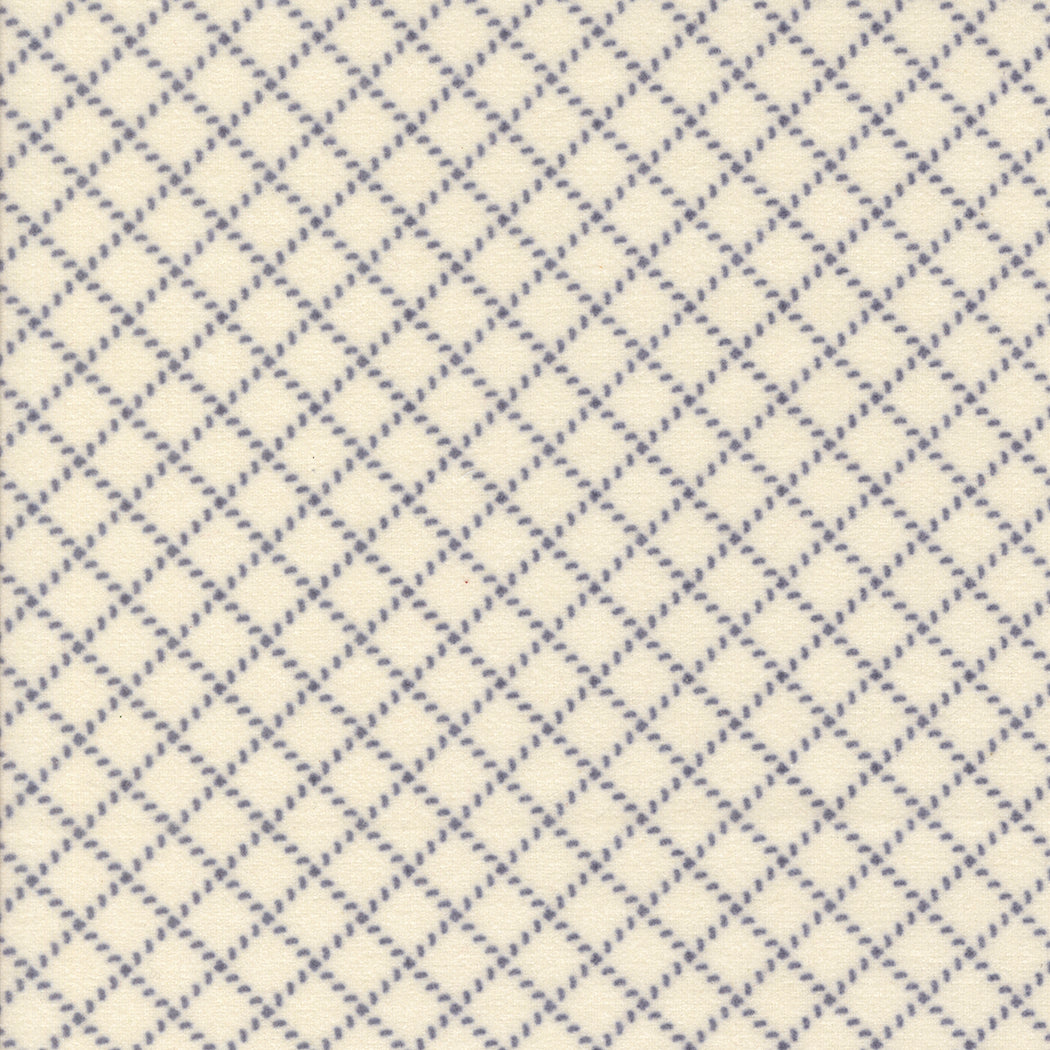 Blue and white diamond pattern on a textured fabric background