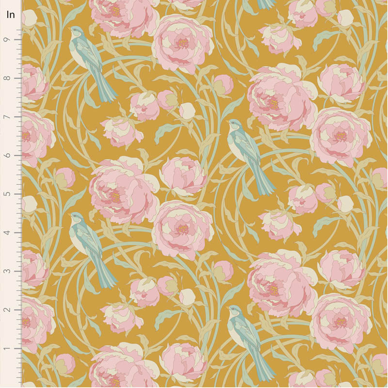 Floral and bird pattern on fabric with a ruler for scale.