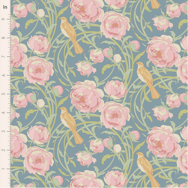 Floral and bird pattern on a blue background with a ruler for scale.