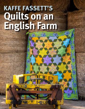 Cover of book featuring a pieced geometric quilt