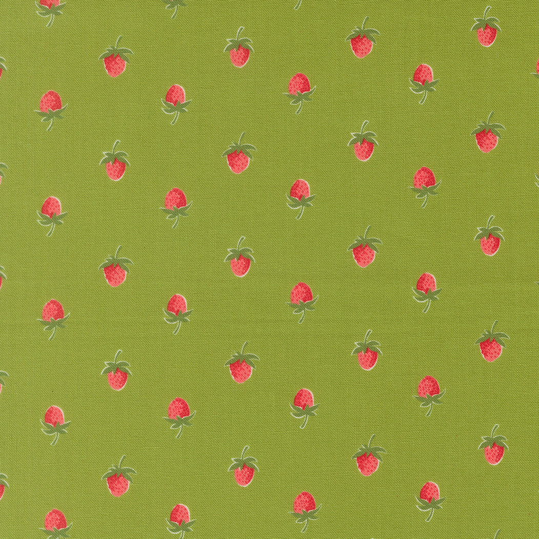 Pattern of red strawberries on a green fabric background