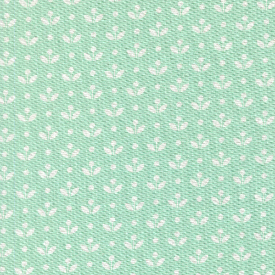 White floral pattern on a light green background