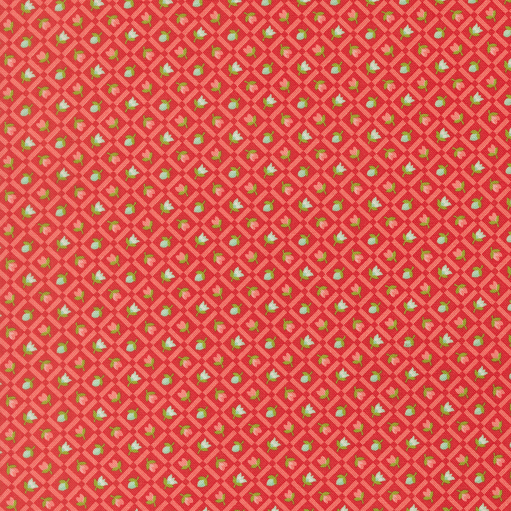 Red fabric with a small green and white pattern