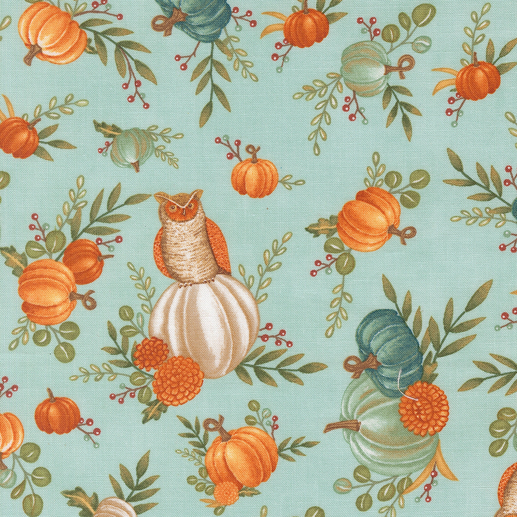 Pattern of pumpkins, owls, and leaves on a blue background