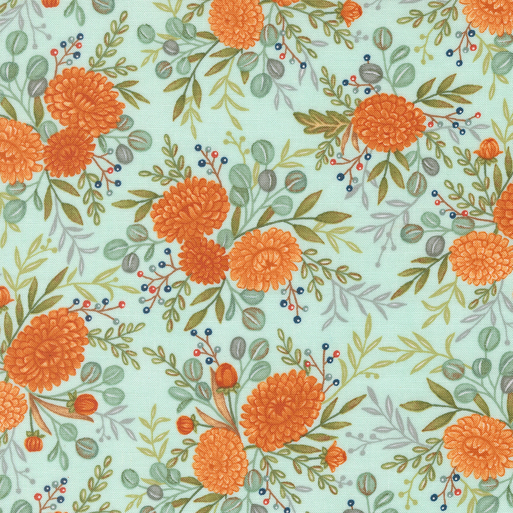 Pattern of orange flowers and green leaves on a light blue background