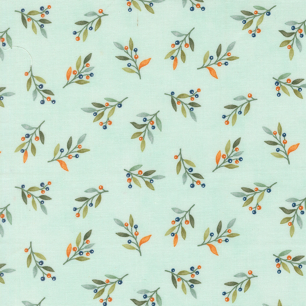 Pattern of leaves and berries on a light blue background