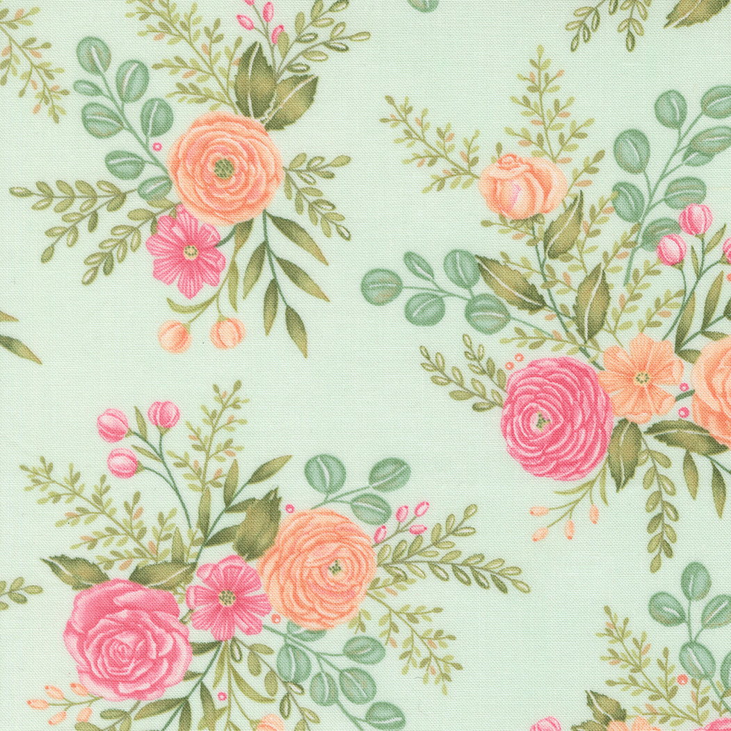 Floral pattern with pink and peach flowers on a light green background