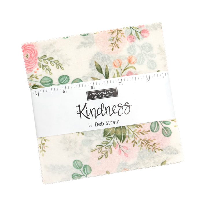Pack of fabric squares with floral pattern and 'Kindness' label on a white background
