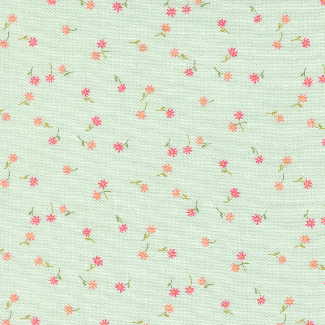 Pattern of small pink flowers on a light green background