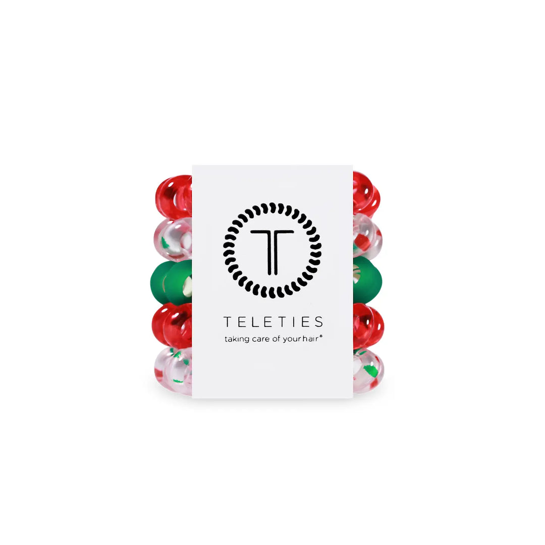 Set of colorful hair ties with a 'Teleties' brand card on a white background