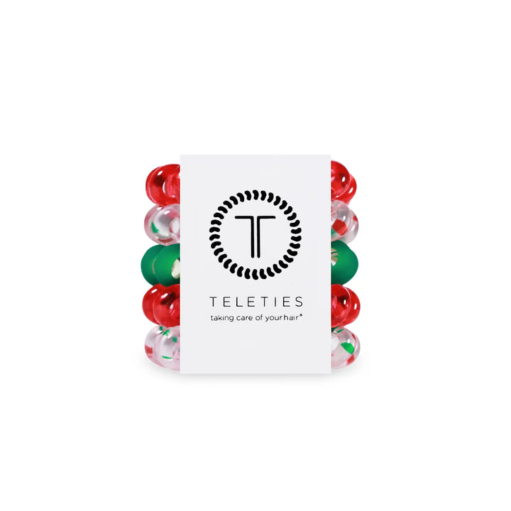 Set of colorful hair ties with a 'Teleties' brand card on a white background